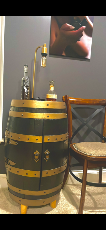Black and gold painted barrel with brass bands and vintage lamp fixture
